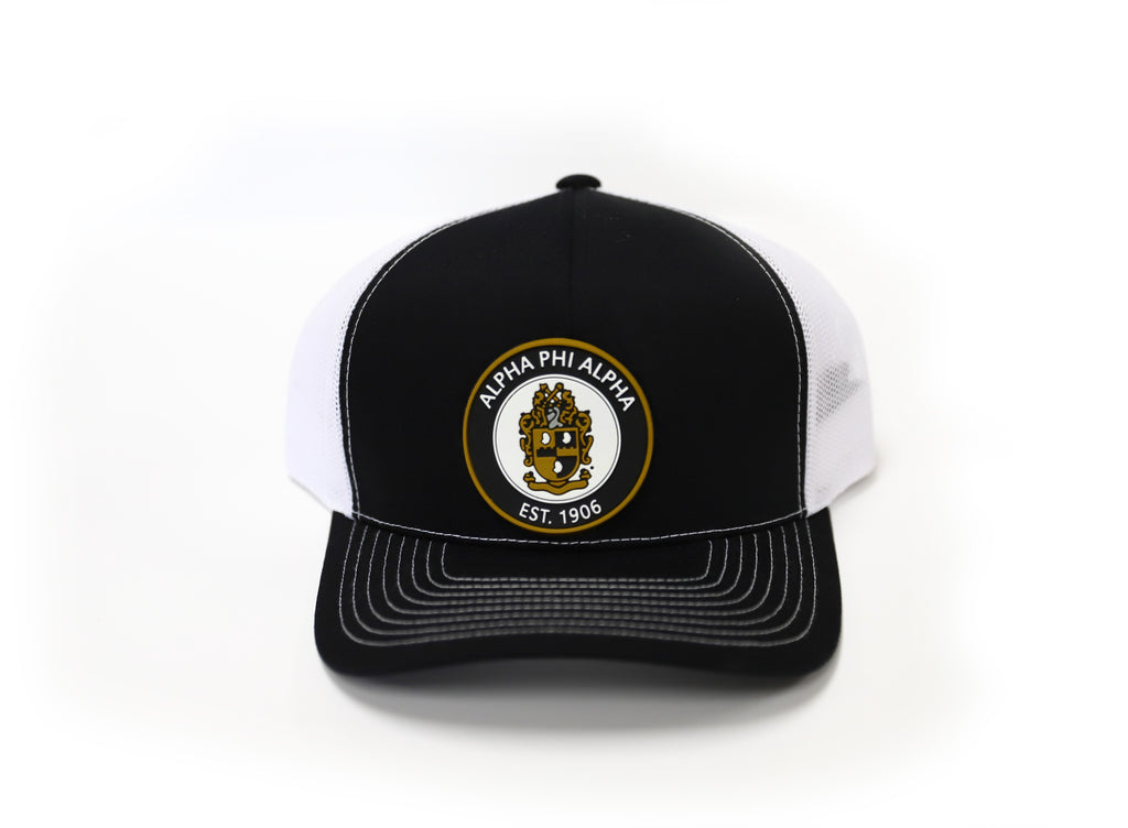 Alpha Trucker Hat with Round PVC Emblem