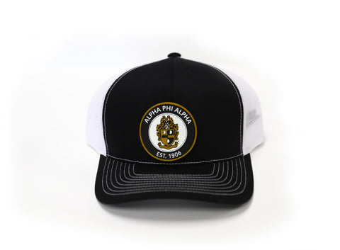Alpha Trucker Hat with Round PVC Emblem